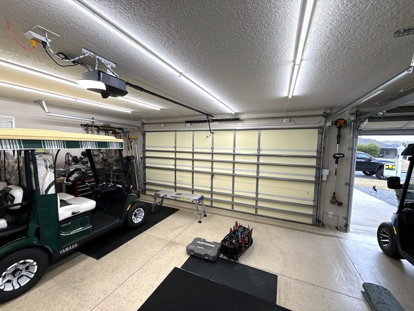 Golf cart garage with a new garage door and opener installed
